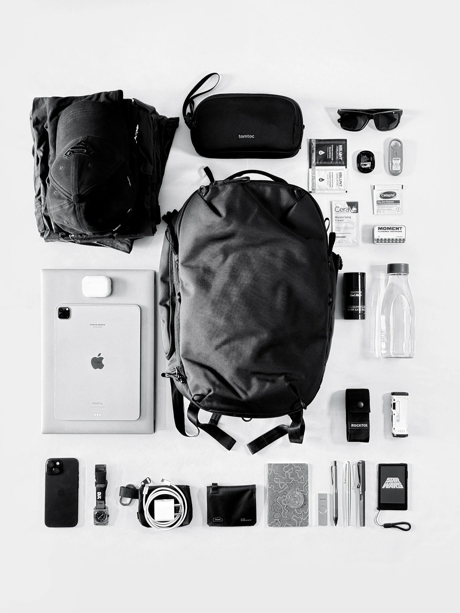 Daily Dash surrounded by everyday essentials in an overhead flatlay