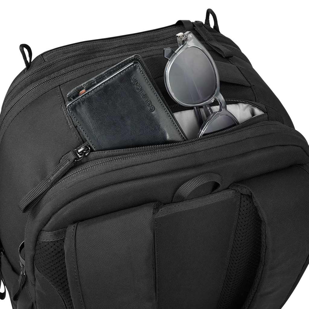 Black backpack with compartments containing a phone and sunglasses on a white background