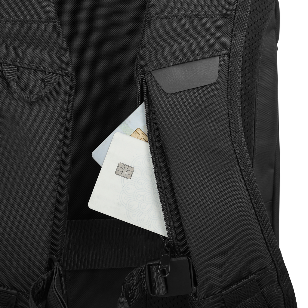 Black backpack with a pocket open, revealing a card and paper inside.