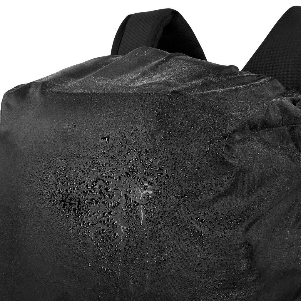 Close-up of a black raincoat with water droplets on a black background