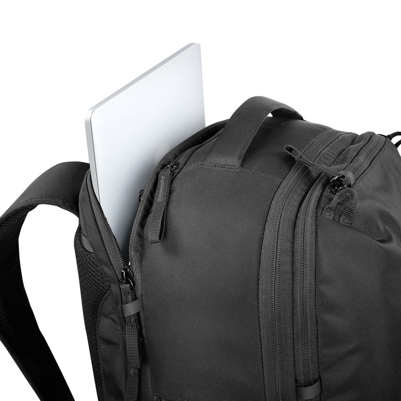 Black backpack with a laptop partially sticking out on a white background