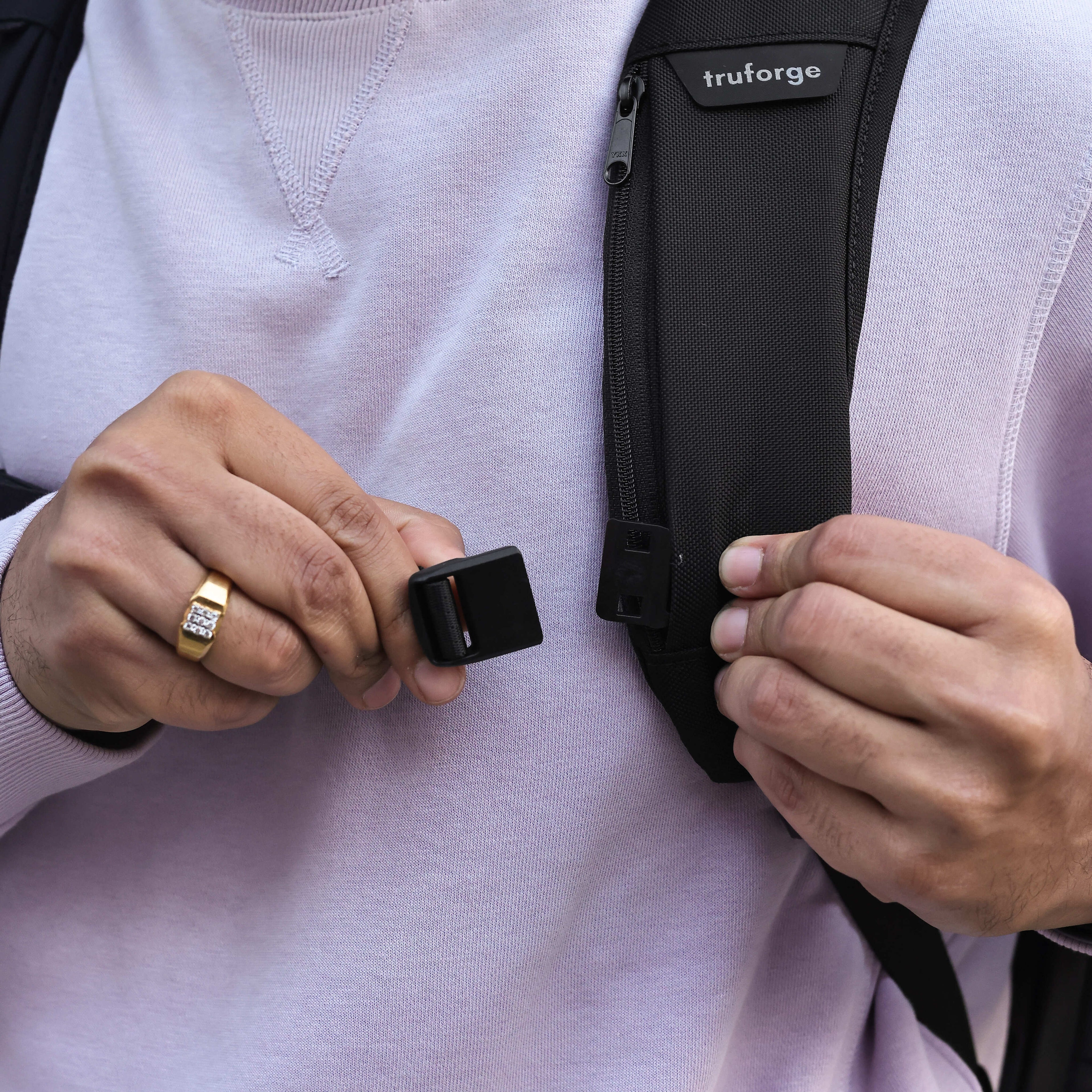Person attaching sternum strap 